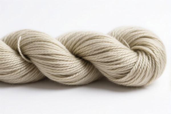 Twisted synthetic staple fiber yarn